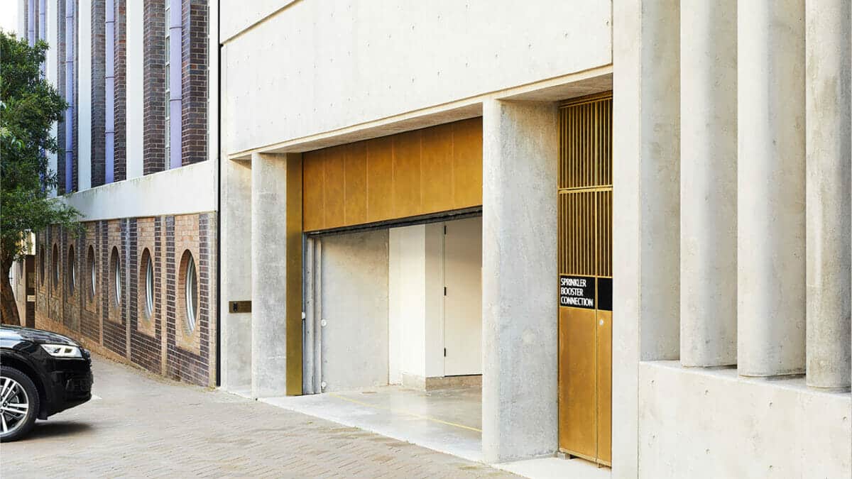 Brass-Garage-Door-Open-Black-Car-Architectural-Buildings-Sydney