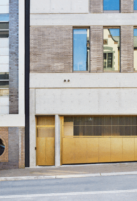 Brass-Garage-Door-Opening-And-Closing-Blue-Car-Inside