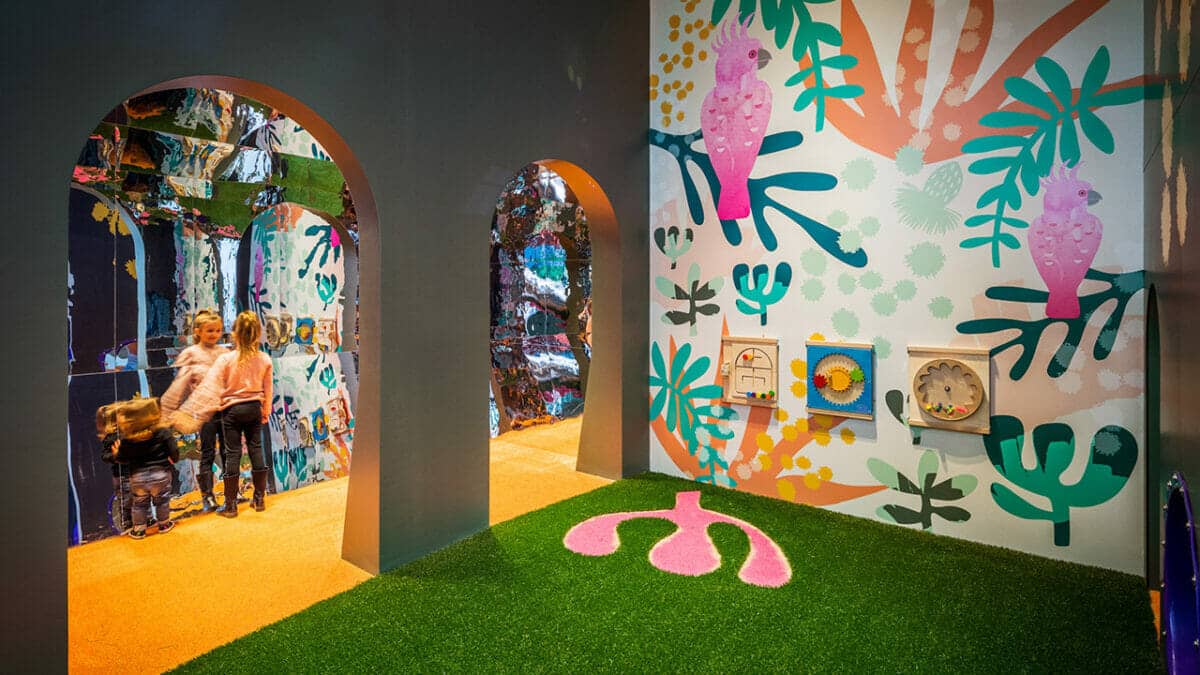 Indoor-Play-Space-Patterned-Walls-Vibrant-Children-Organic-Form.