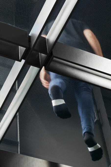 Glass-landing-guy-walking-upstairs-architecturally-designed-Tilt-industrial-Design