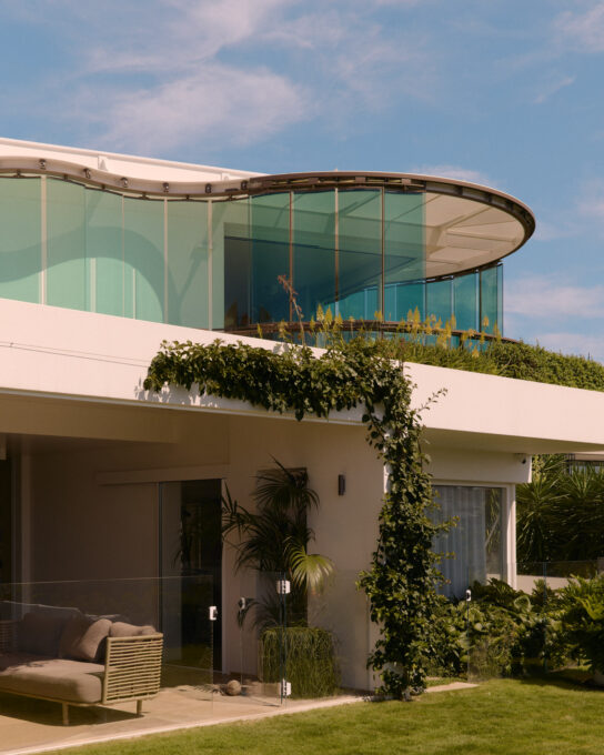Glass louvre facade on residential beachside home by Luigi Rosselli Architects and Tilt Industrial Design